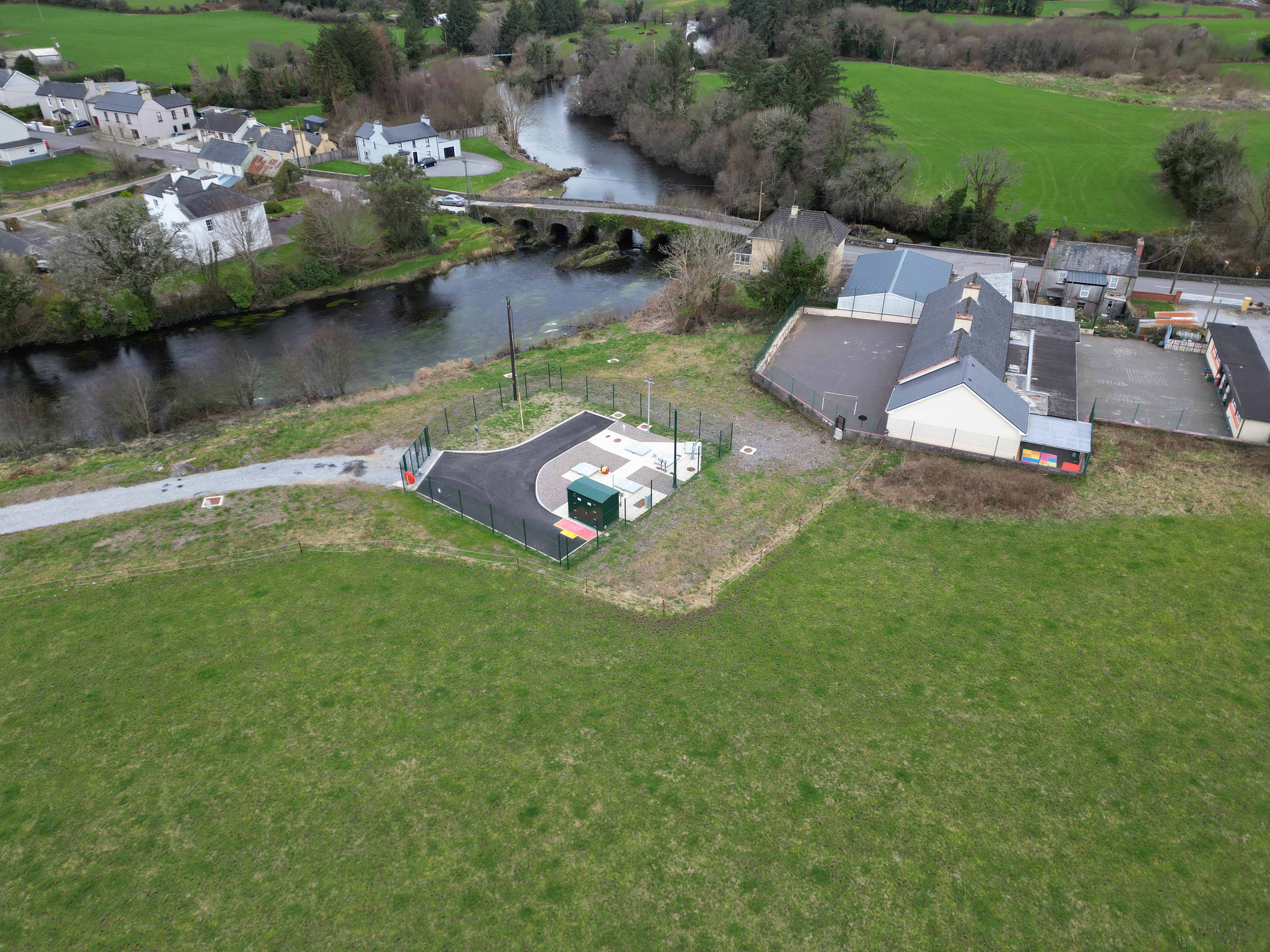 A small housing neighbourhood beside a bridge over a river