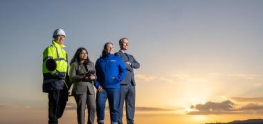 Four people on a beach