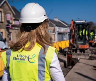 Lead engineer standing infront of road works by Uisce Éireann