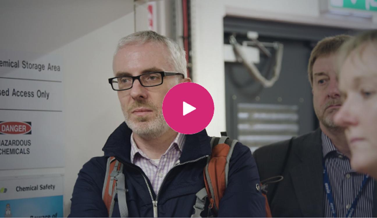 Three people in an airport with a backpack on